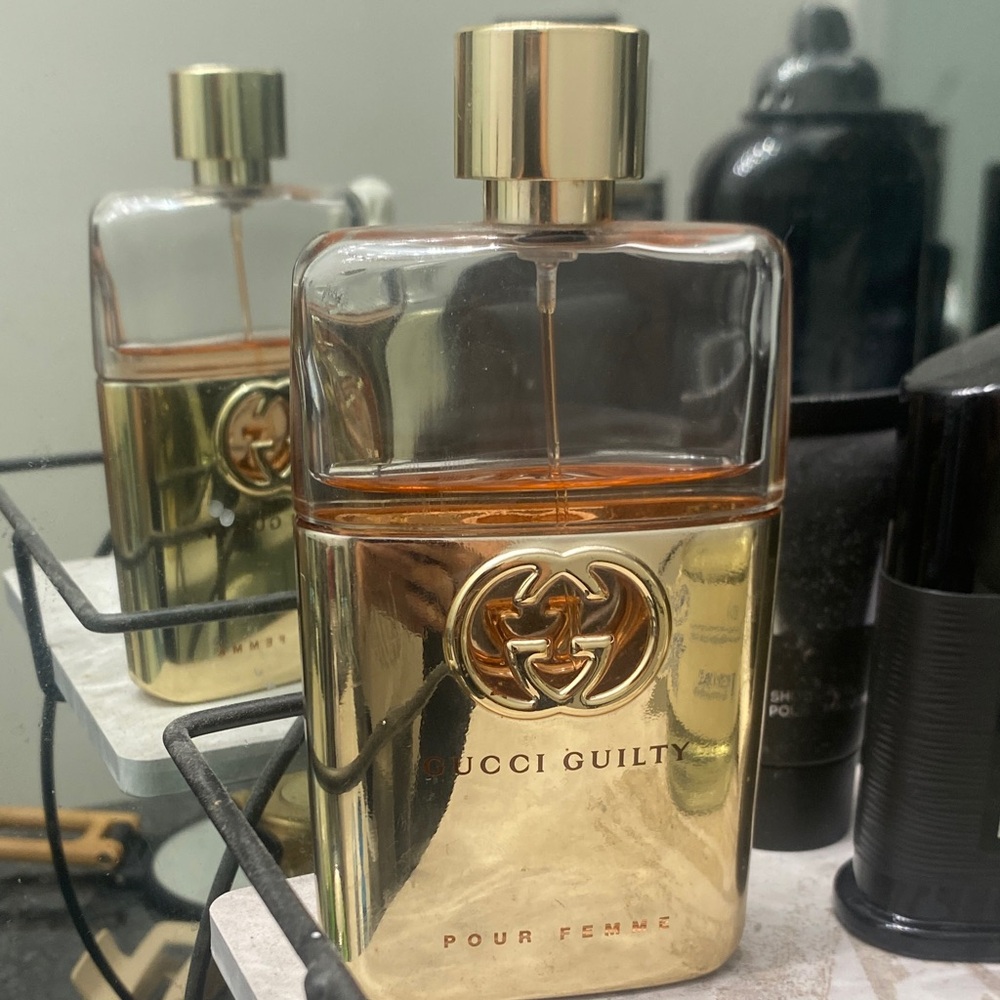 Gucci Gold and Clear Perfume Bottle
